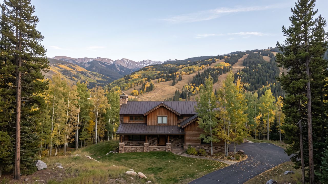 Mountain home among autumn aspens below Vail Mountain